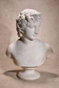 A Continental sculpted white marble bust of a youthful Apollo, late 18th / early 19th century,