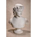 A Continental sculpted white marble bust of a youthful Apollo, late 18th / early 19th century,