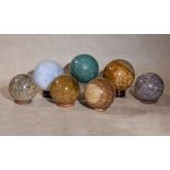 A group of seven assorted polished hardstone mineral specimen spheres, comprising one of chrysacola,