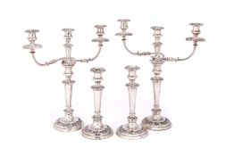 A composed set of four George IV/ William IV silver candlesticks, one a pair by Henry Wilkinson &