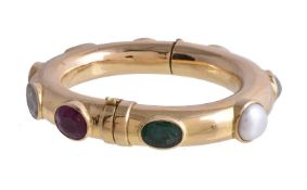 ϒ A multi gem set Navaratna hinged bangle, the hollow hinged bangle set with the nine gemstones