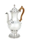 A George III silver baluster coffee pot by Charles Wright, London 1771, with a wrythen finial to the