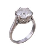 A single stone diamond ring, the old brilliant cut diamond weighing 3.16 carats in a six claw
