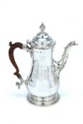 An early George III silver baluster coffee pot by Benjamin Bickerton, London 1763, with a beaded