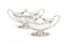 A pair of silver navette pedestal sauce tureens and covers by Asher Solovitch, London 1910, in