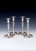 A set of four late George II cast silver hexafoil candlesticks by William Cafe, London 1757, with