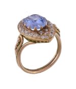 A sapphire and diamond marquise shaped panel ring, the oval cut sapphire estimated to weigh 2.88