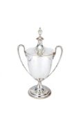 A silver twin handled trophy cup and cover by Garrard & Co. Ltd (Sebastian Garrard), London 1937, in