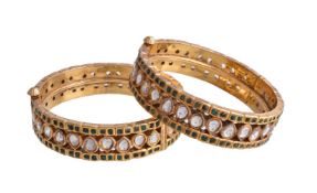 A pair of Indian white and green stone bangles, the hinged bangles with kundan set pear shaped