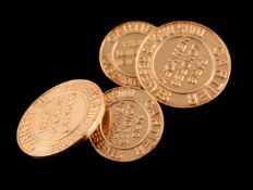 A pair of gold coloured cufflinks by Cartier, the circular panels stamped Cartier Tous detrits