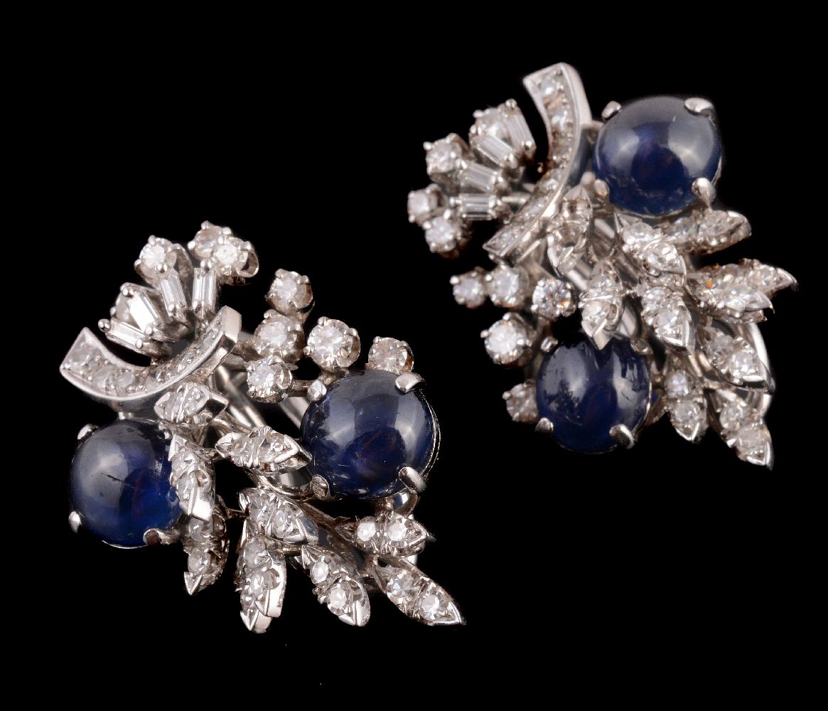 A pair of diamond and sapphire foliate spray ear clips, the circular cabochon sapphires with