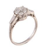 A single stone diamond ring, the old brilliant cut diamond weighing 1.13 carats, between two tapered