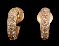 A pair of diamond hooped earrings by Cartier, the pave set brilliant cut diamond hoops,