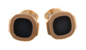 A pair of 18 carat gold Nautilus cufflinks by Patek Philippe, the panels each set with a reeded