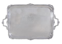 An Edwardian silver shaped rectangular twin handled tray by S. W. Smith & Co., London 1903,