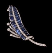 A French sapphire and diamond brooch, designed as a leaf, set with two rows of rectangular cut