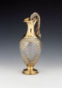 A Victorian silver gilt and etched glass claret jug by Goldsmiths Alliance Ltd (Samuel Smily),