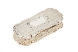 A Victorian shaped oblong table snuff box by Derry & Jones, Birmingham 1861, the cover centred by