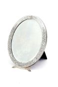 An American silver mounted oval dressing table mirror by I. N. Deitsch, New York, early 20th