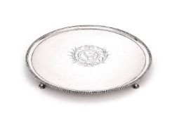A George III silver large circular salver by Elizabeth Cooke, London 1772, with a raised gadrooned