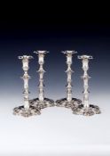 A matched set of four George III cast hexafoil candlesticks, three by William Cafe, London 1761 (