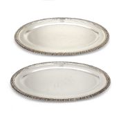 A pair of silver oval meat plates by Edward Barnard & Sons Ltd, London 1934, with raised gadrooned