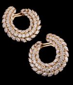 A pair of diamond crescent earrings, the scrolled earrings set with graduating brilliant cut and