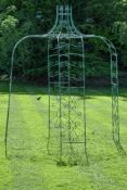 A painted wrought iron garden pergola, last quarter 20th century, the circlet top with eight