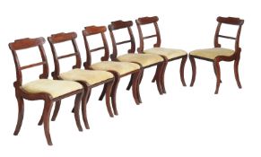 A set of six Regency mahogany dining chairs, circa 1815, of Trafalgar type, with sail bar back above