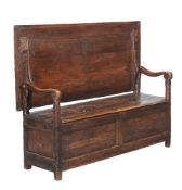 A pine monks bench, early 18th century, 76cm high as a table, the top 150cm wide, 72cm deep