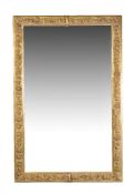 A French gilt bronze wall mirror, mid-19th century, the frame cast with flower heads throughout,