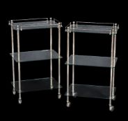 A pair of glass and chrome three tier etageres, by Aquadomo, of recent manufacture, 81cm high,