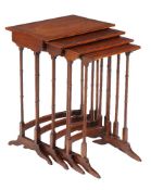 A nest of mahogany and feather banded quartetto tables, 19th century, the largest 70cm high, 50cm