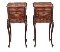 A pair of French walnut marble topped bedside tables, early 20th century, of serpentine outline,