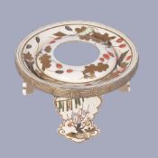 ϒ An Ivory Sakezuki Stand, of circular form raised on three shaped legs, the whole decorated in gold