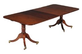 A mahogany dining table, early 19th and later, to include two additional leaf insertions, 73cm high,