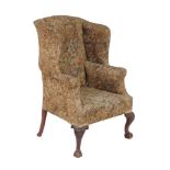 A mahogany and upholstered wing armchair in George III style, late 19th/early 20th century, 119cm