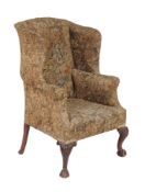 A mahogany and upholstered wing armchair in George III style, late 19th/early 20th century, 119cm