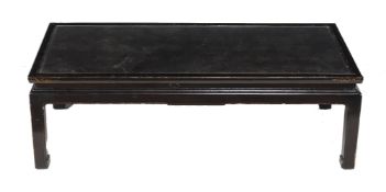 A black lacquer coffee table, in Chinese taste, the top with various parcel gilt Chinese characters,