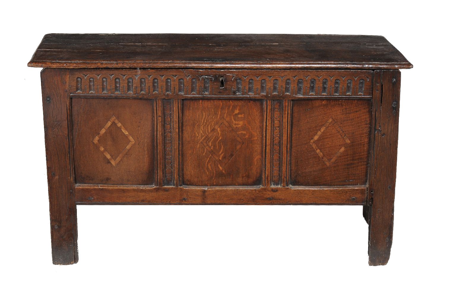 An oak coffer, 17th century, the panels each with lozenge parquetry inlay, 65cm high, 113cm wide,