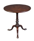 A George III mahogany tilt top table, circa 1780, with single plank top and a wrtyhen vase, 70cm