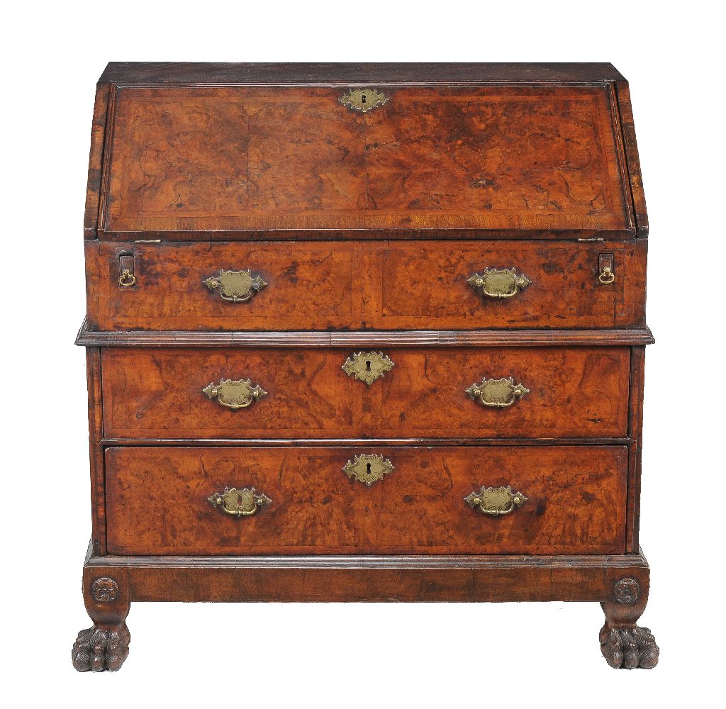 A Queen Anne walnut bureau, circa 1705, the fall enclosing an arrangement of drawers and pigeonholes