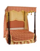 A mahogany four post bed, circa 1815 and later, incorporating fabric covered pelmets and a pleated