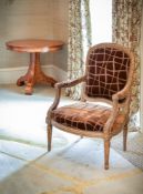 A giltwood and upholstered armchair in in Louis XVI style, 20th century, and a pair of cream painted