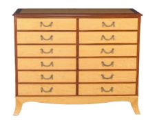 A pair of satinwood and banded chests of drawers, of recent manufacture, in the manner of Linley,