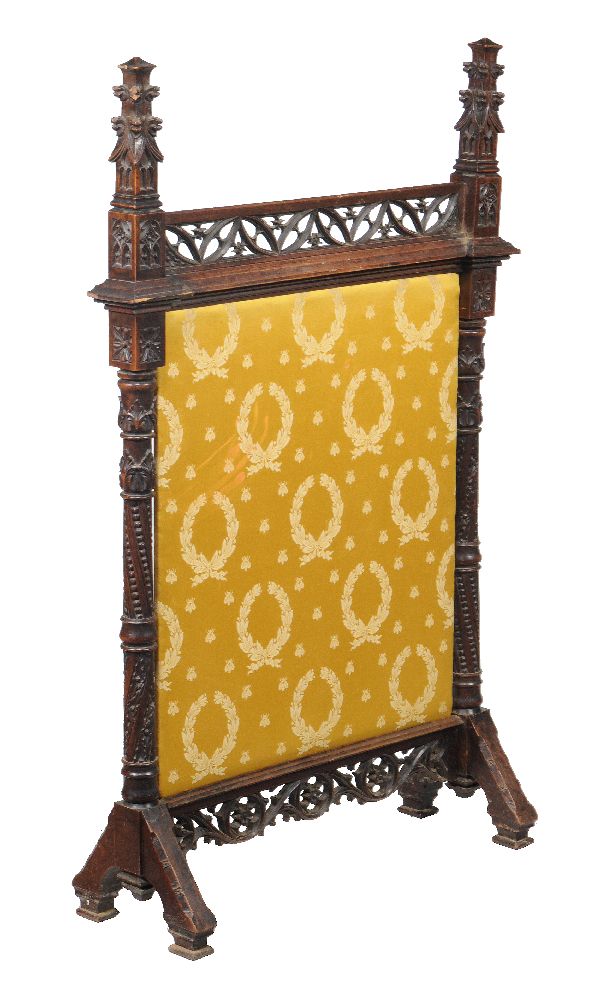 A Victorian Gothic Revival mahogany firescreen, circa 1860, 126cm high, 78cm wide