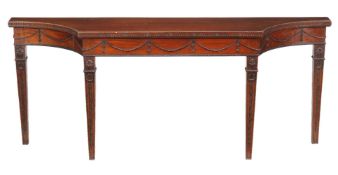 A mahogany serving table in George III ‘Adam’ style, circa 1900, of breakfront outline, the fluted