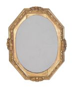 An Italian giltwood mirror, 17th century, of octagonal form, with four prominent acanthus leaves and