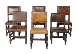 A harlequin set of oak and leather upholstered dining chairs, of Commonwealth type, including some