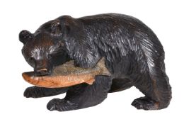 A carved and stained softwood model of a bear, late 20th century, in the manner of Black Forest